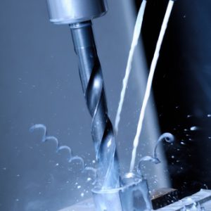 Industrial machine tool drilling into aluminum